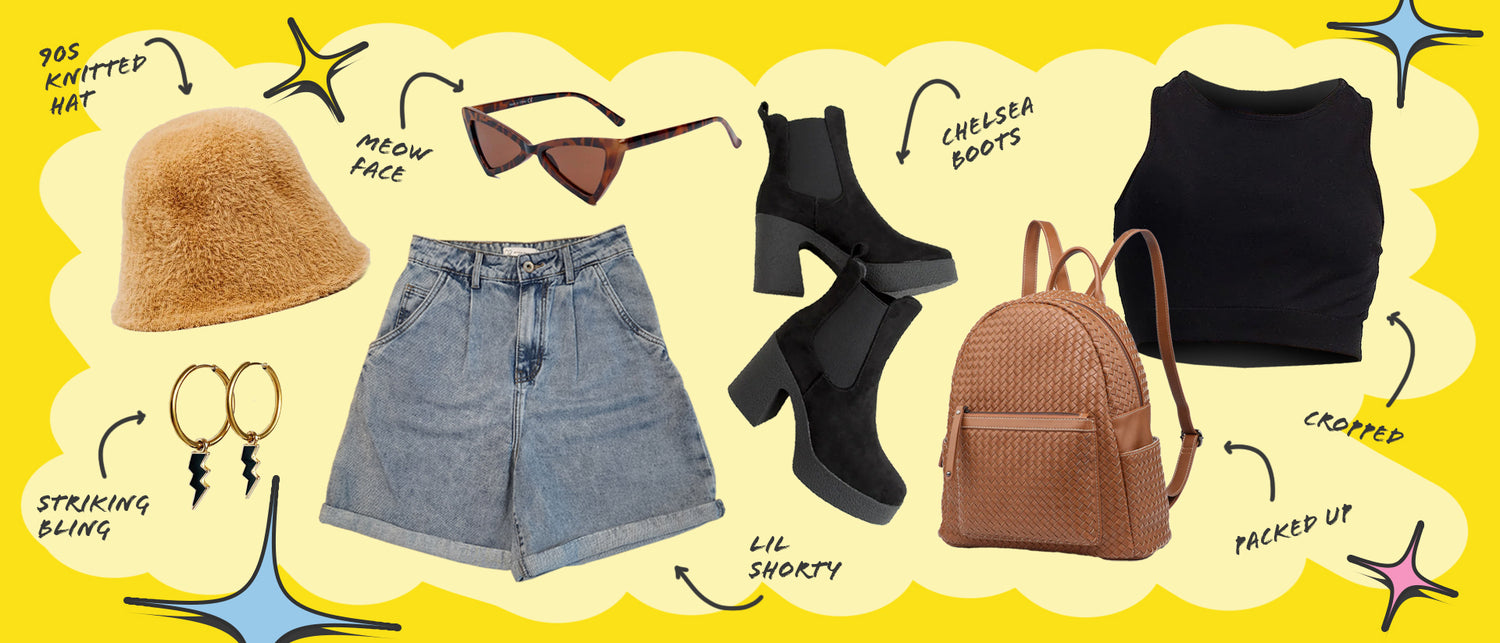 A flat lay of clothing including a black tank top, denim shorts, a brown backpack purse, black booties, cat-eye sunglasses, a fuzzy hat, and lightening bolt hoop earrings.